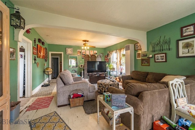 124 S M St, Livingston, MT 59047 - living room featuring arched walkways and ceiling fan