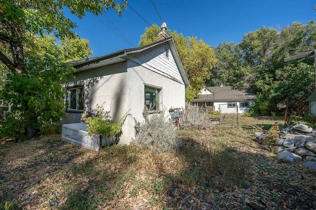 124 S M St, Livingston, MT 59047 - view of home's exterior with stucco siding