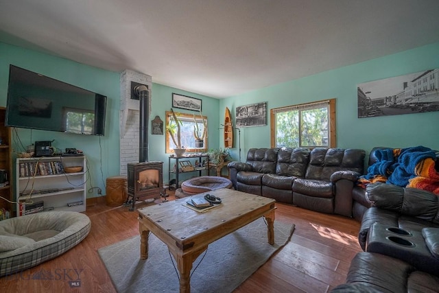 124 S M St, Livingston, MT 59047 - living area with a wood stove and wood finished floors