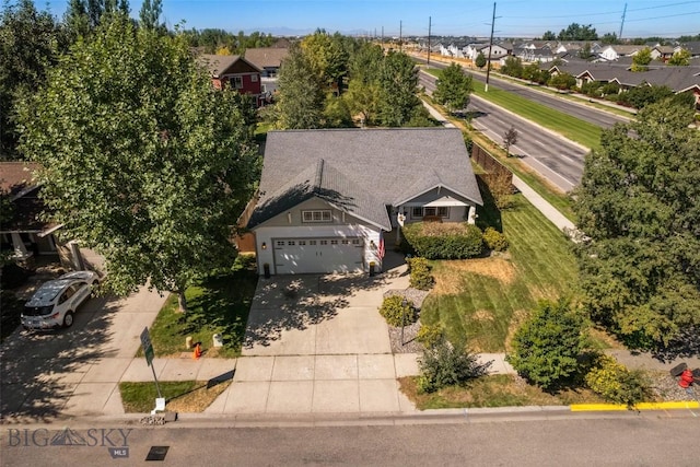 birds eye view of property with a residential view