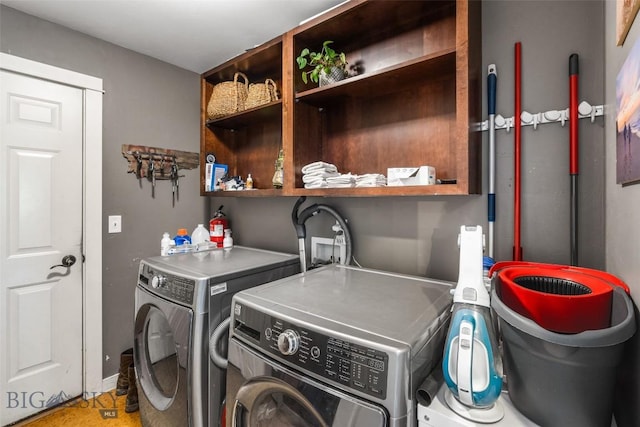 clothes washing area with laundry area and separate washer and dryer