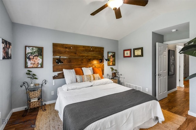 bedroom with wood-type flooring, a ceiling fan, baseboards, lofted ceiling, and visible vents