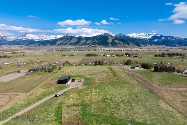 drone / aerial view featuring a rural view and a mountain view