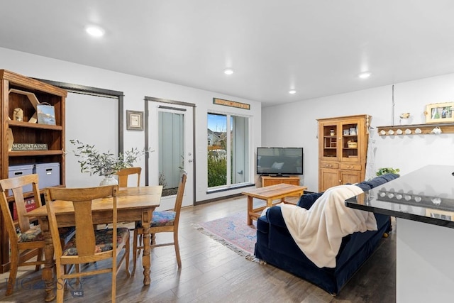 living room with recessed lighting and wood finished floors