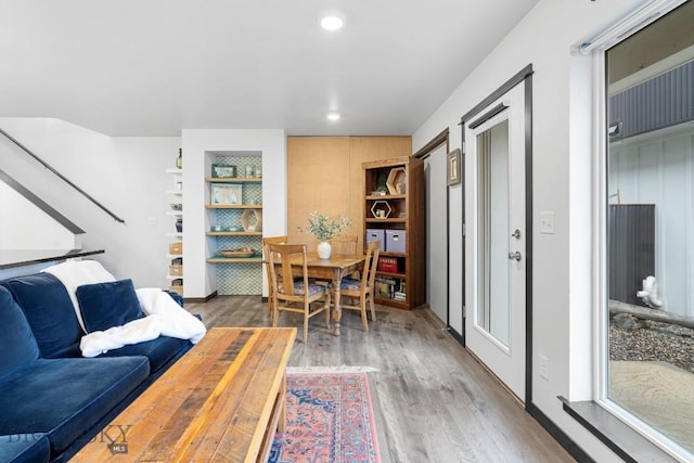 living room featuring recessed lighting and wood finished floors
