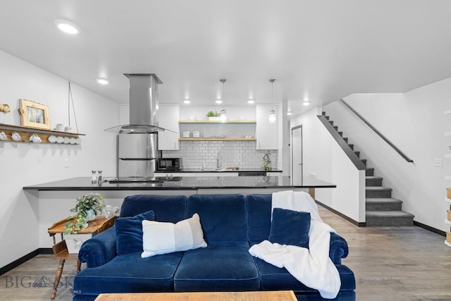 2448 Gallatin Green Blvd Unit F, Bozeman, MT 59718 - living room with baseboards, recessed lighting, stairs, and wood finished floors