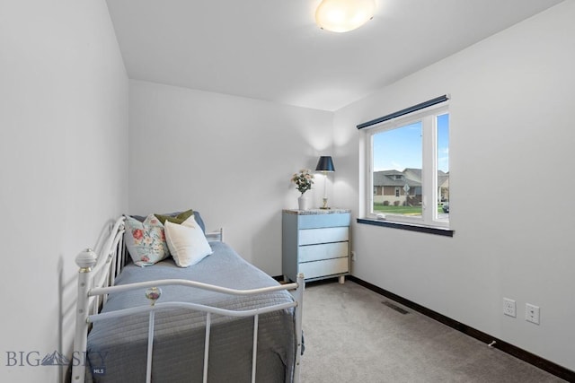 bedroom with carpet flooring, baseboards, and visible vents
