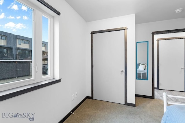2448 Gallatin Green Blvd Unit F, Bozeman, MT 59718 - unfurnished bedroom featuring carpet floors and baseboards