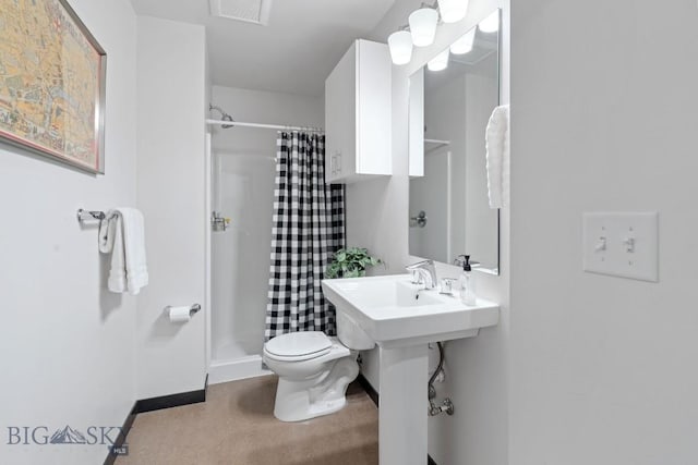 bathroom with toilet, baseboards, visible vents, and a stall shower