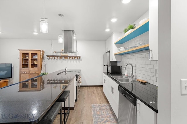 2448 Gallatin Green Blvd Unit F, Bozeman, MT 59718 - kitchen with open shelves, dark countertops, island range hood, a sink, and stainless steel appliances