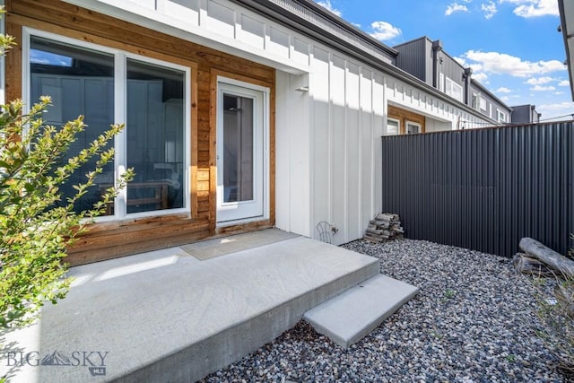 2448 Gallatin Green Blvd Unit F, Bozeman, MT 59718 - view of exterior entry with fence and board and batten siding