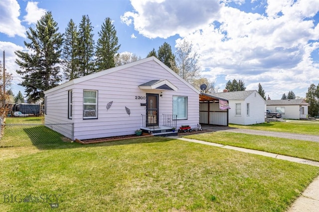 2300 S Dr, Butte, MT 59701 - bungalow-style house featuring a front lawn, driveway, fence, and a carport