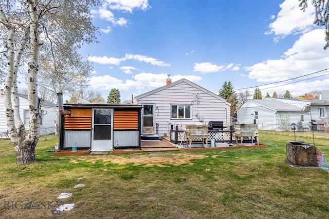 2300 S Dr, Butte, MT 59701 - rear view of house featuring a yard, fence, and a wooden deck