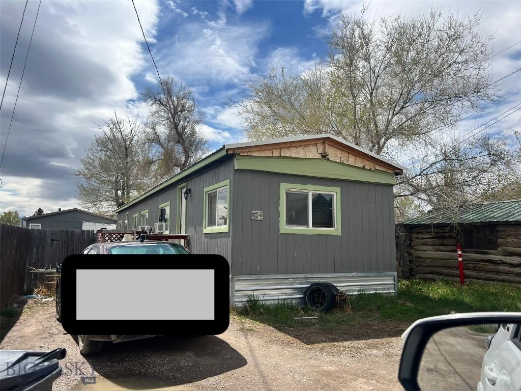 view of home's exterior featuring fence