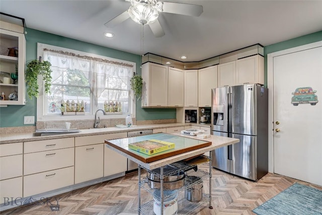 623 N Grand Ave, Bozeman, MT 59715 - kitchen featuring stainless steel fridge, light countertops, a sink, and white cabinetry