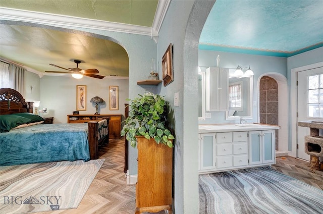 623 N Grand Ave, Bozeman, MT 59715 - bedroom featuring crown molding, arched walkways, and a sink