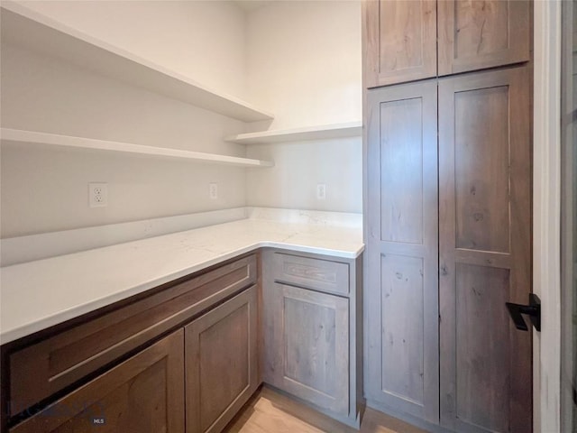 51 W Granite Peak, Bozeman, MT 59718 - kitchen featuring open shelves and light stone counters