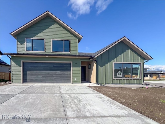 51 W Granite Peak, Bozeman, MT 59718 - view of front of property with driveway, an attached garage, and board and batten siding