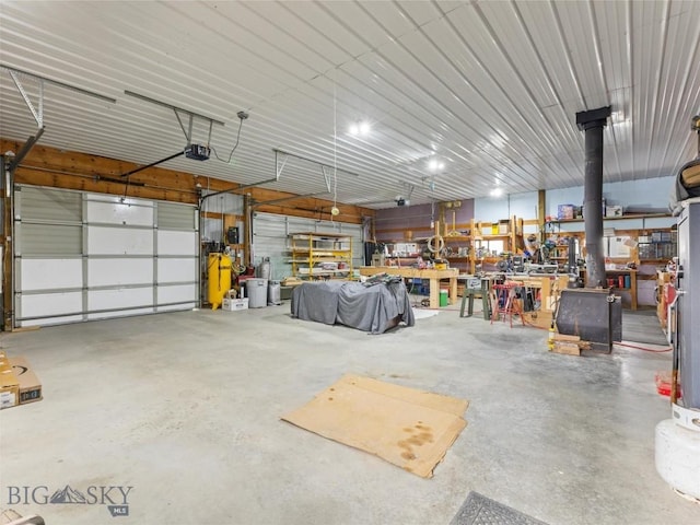 garage with a workshop area and a garage door opener