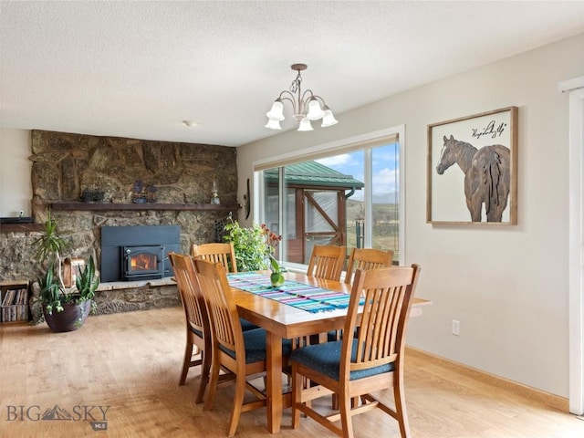 dining room with a notable chandelier and wood finished floors