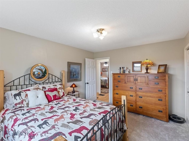 bedroom featuring light carpet