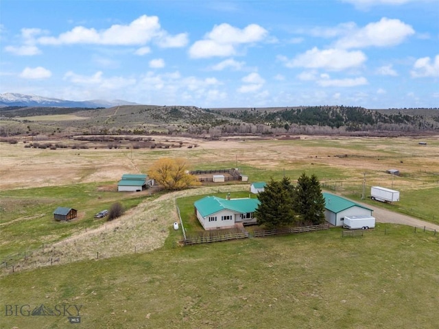 drone / aerial view with a mountain view and a rural view