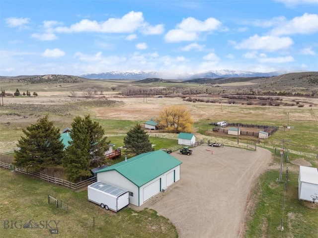 bird's eye view featuring a rural view and a mountain view