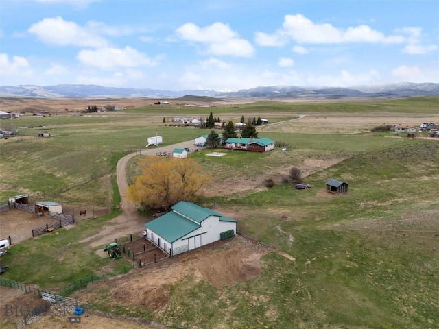 drone / aerial view with a mountain view and a rural view