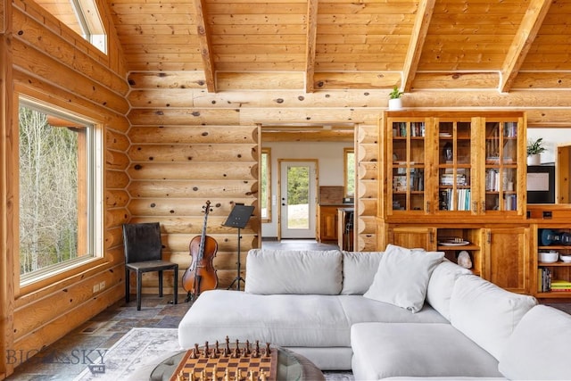 living room featuring rustic walls, stone finish floor, plenty of natural light, and wood ceiling