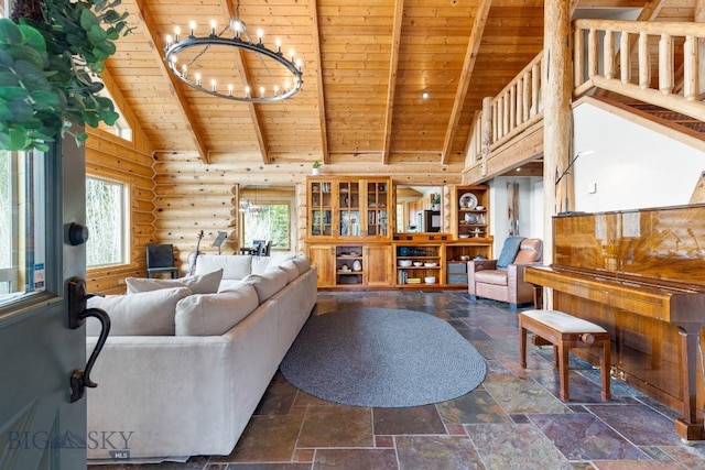 living room with stone tile floors, a notable chandelier, wooden ceiling, and a wealth of natural light