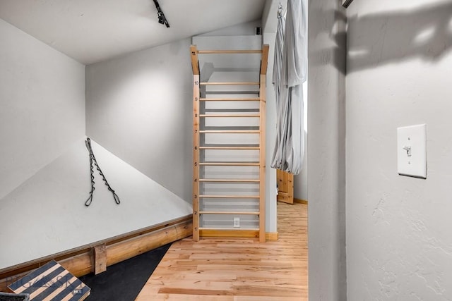 stairway with wood finished floors