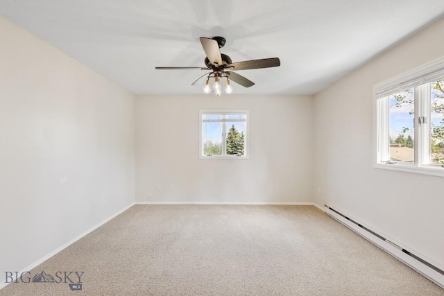 empty room featuring carpet floors, a healthy amount of sunlight, and a baseboard radiator