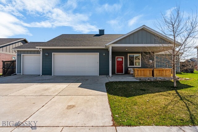 1604 Drummond Blvd, Belgrade, MT 59714 - single story home with a shingled roof, an attached garage, a front lawn, board and batten siding, and concrete driveway