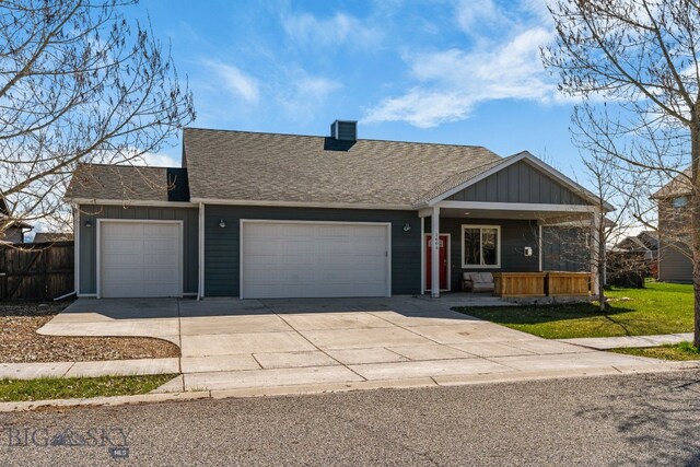 1604 Drummond Blvd, Belgrade, MT 59714 - ranch-style house with an attached garage, board and batten siding, a porch, a chimney, and concrete driveway