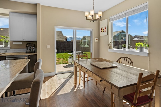 1604 Drummond Blvd, Belgrade, MT 59714 - dining area featuring an inviting chandelier and wood finished floors