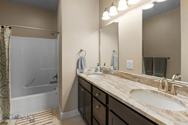 1604 Drummond Blvd, Belgrade, MT 59714 - bathroom featuring a sink, tile patterned floors, shower / bath combo, and double vanity