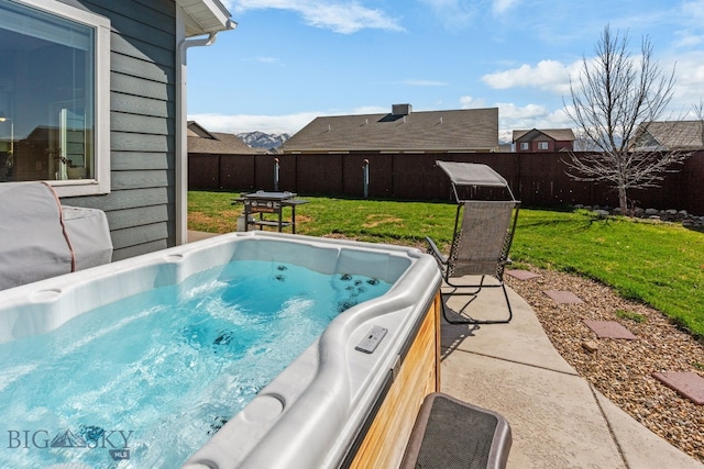 1604 Drummond Blvd, Belgrade, MT 59714 - view of pool with a lawn, a hot tub, and a fenced backyard