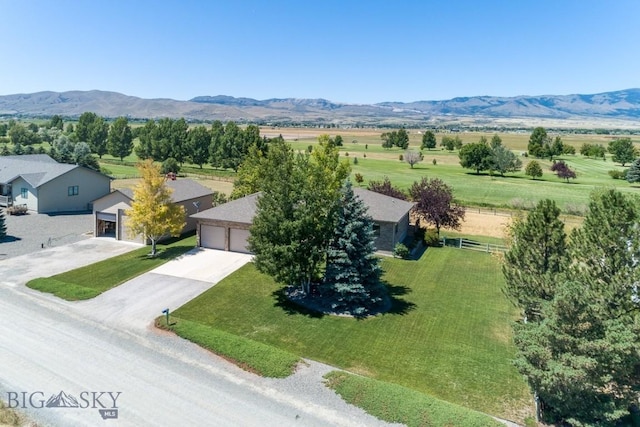 drone / aerial view with a mountain view and a rural view