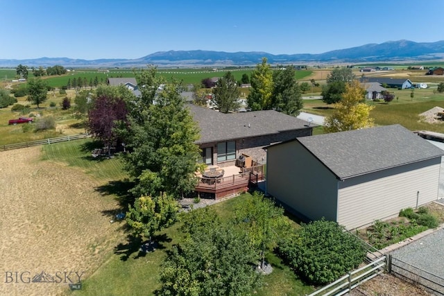 drone / aerial view featuring a mountain view and a rural view