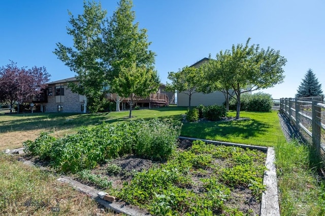 view of yard with fence and a deck
