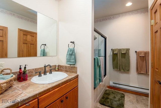 full bathroom featuring vanity, baseboard heating, combined bath / shower with glass door, and recessed lighting
