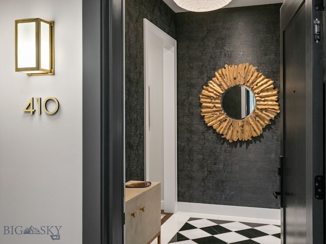 bathroom featuring baseboards and tile patterned floors