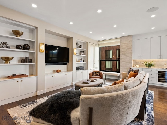 living area with recessed lighting, built in features, dark wood-style floors, and beverage cooler