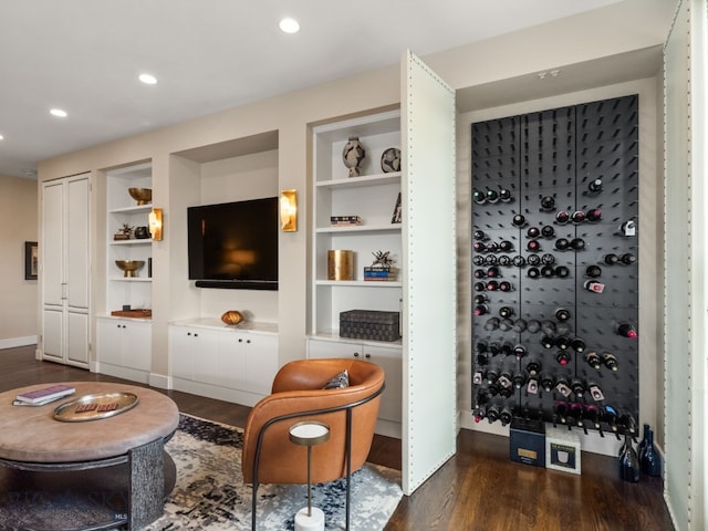 interior space with recessed lighting, baseboards, dark wood-style flooring, and built in shelves