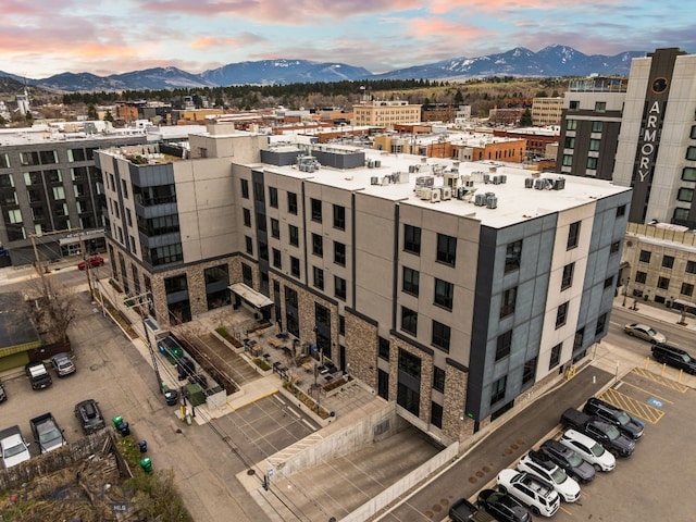 view of building exterior with a view of city and a mountain view