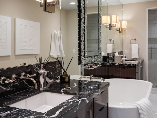 interior space with a soaking tub and vanity