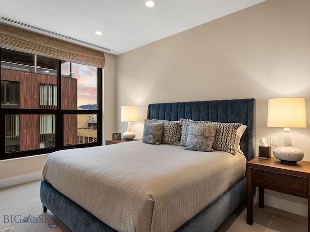 bedroom featuring recessed lighting, carpet, and baseboards