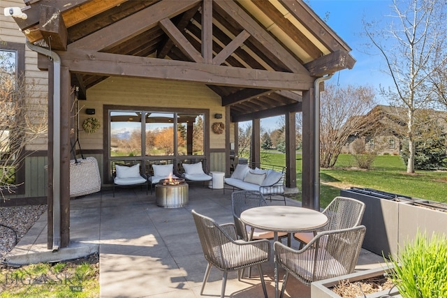 view of patio / terrace featuring an outdoor living space with a fire pit