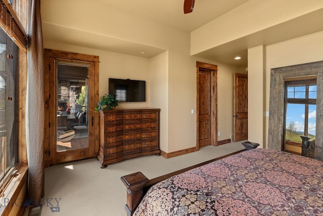 carpeted bedroom featuring recessed lighting, baseboards, ceiling fan, and multiple windows