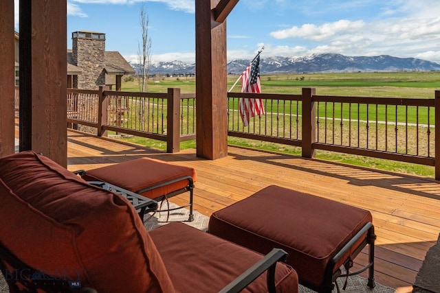 deck featuring a mountain view and a rural view